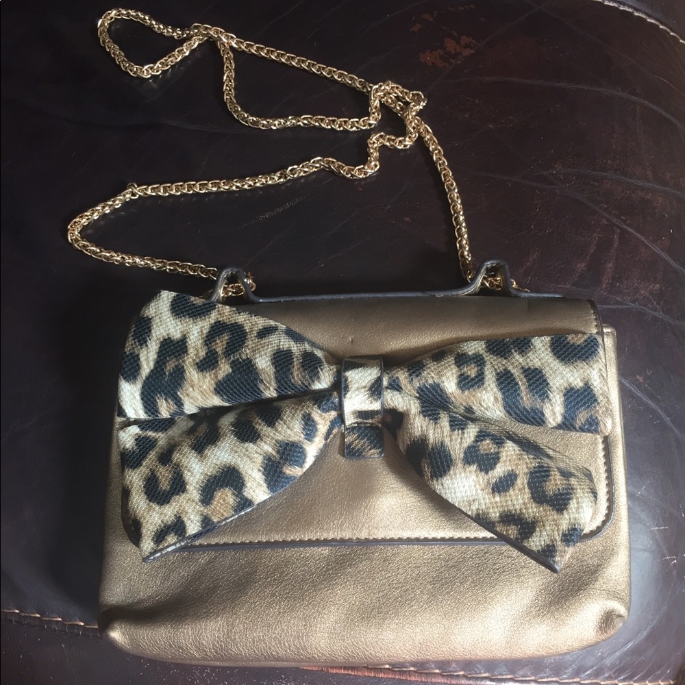 Gold and cheetah print clutch with gold chain